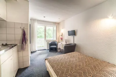 Ein Bett oder Betten in einem Zimmer der Unterkunft Ferienanlage Duhnen Haus 23