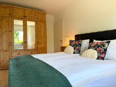 Ein Bett oder Betten in einem Zimmer der Unterkunft FeWo 1