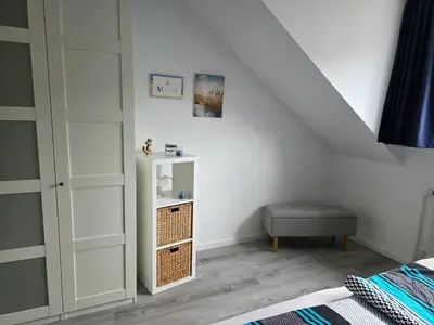 Ein Bett oder Betten in einem Zimmer der Unterkunft Ferienwohnung Hafenkajüte