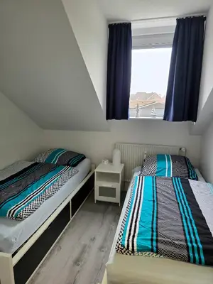 Ein Bett oder Betten in einem Zimmer der Unterkunft Ferienwohnung Hafenkajüte