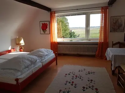 Ein Bett oder Betten in einem Zimmer der Unterkunft Berberhof