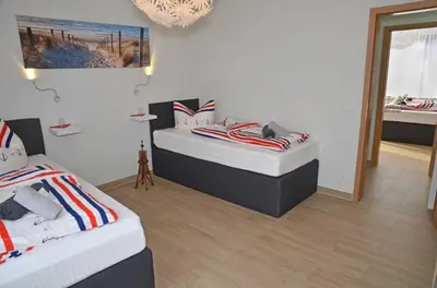 Ein Bett oder Betten in einem Zimmer der Unterkunft Hotel Neptuns Ankerplatz & Zur Seerobbe