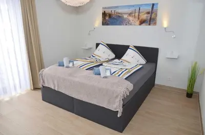 Ein Bett oder Betten in einem Zimmer der Unterkunft Hotel Neptuns Ankerplatz & Zur Seerobbe