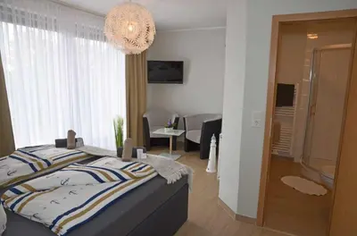 Ein Bett oder Betten in einem Zimmer der Unterkunft Hotel Neptuns Ankerplatz & Zur Seerobbe