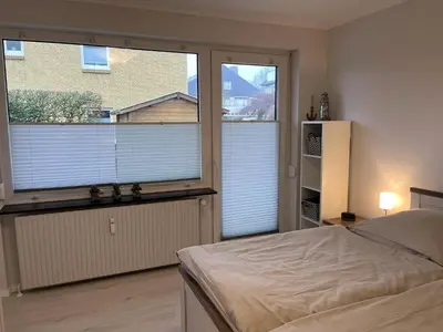 Ein Bett oder Betten in einem Zimmer der Unterkunft MeeresZeit