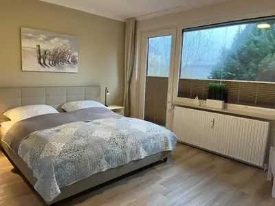 Ein Bett oder Betten in einem Zimmer der Unterkunft Austernfischer
