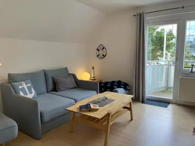 Ein Sitzbereich in der Unterkunft Wohnung Alkersum