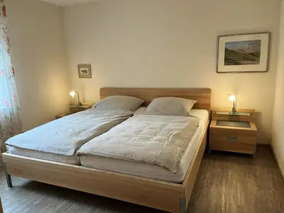 Ein Bett oder Betten in einem Zimmer der Unterkunft Dwarslöper