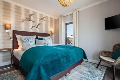 Ein Bett oder Betten in einem Zimmer der Unterkunft Hauke Segelmacherhuus