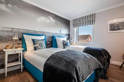 Ein Bett oder Betten in einem Zimmer der Unterkunft Hauke Segelmacherhuus