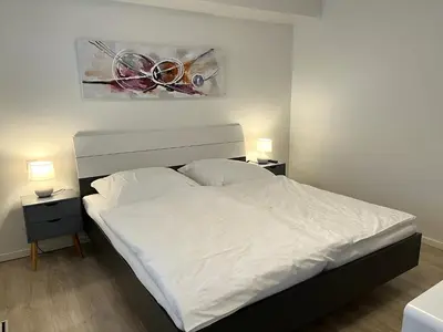 Ein Bett oder Betten in einem Zimmer der Unterkunft Genua