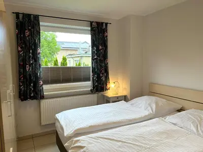 Ein Bett oder Betten in einem Zimmer der Unterkunft Whg 6