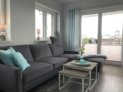 Ein Sitzbereich in der Unterkunft Penthouse meertied