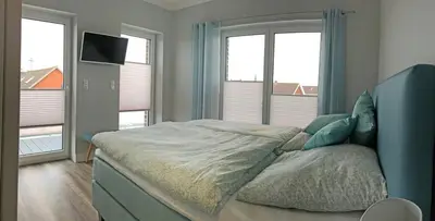 Ein Bett oder Betten in einem Zimmer der Unterkunft Penthouse meertied