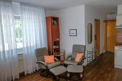 Ein Sitzbereich in der Unterkunft Ferienwohnung Herzmuschel