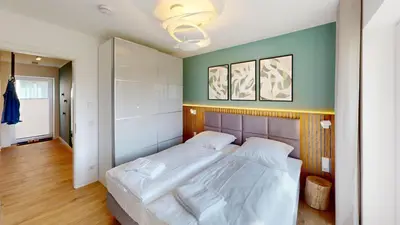 Ein Bett oder Betten in einem Zimmer der Unterkunft Lighthouse Duhner Spitze - W01