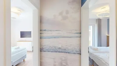 Ein Bett oder Betten in einem Zimmer der Unterkunft Lighthouse Duhner Spitze - W03