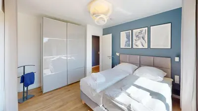 Ein Bett oder Betten in einem Zimmer der Unterkunft Lighthouse Duhner Spitze - W03