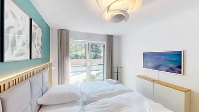 Ein Bett oder Betten in einem Zimmer der Unterkunft Lighthouse Duhner Spitze - W05