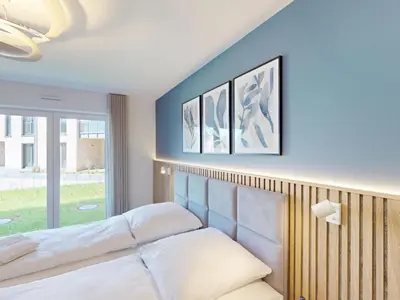 Ein Bett oder Betten in einem Zimmer der Unterkunft Lighthouse Duhner Spitze - W04
