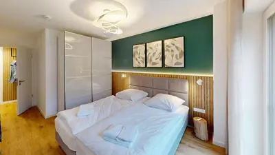 Ein Bett oder Betten in einem Zimmer der Unterkunft Lighthouse Duhner Spitze - W09