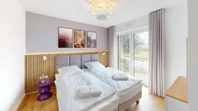 Ein Bett oder Betten in einem Zimmer der Unterkunft Lighthouse Duhner Spitze - W06