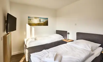 Ein Bett oder Betten in einem Zimmer der Unterkunft Zuhause In Duhnen - 312 - Steenloper