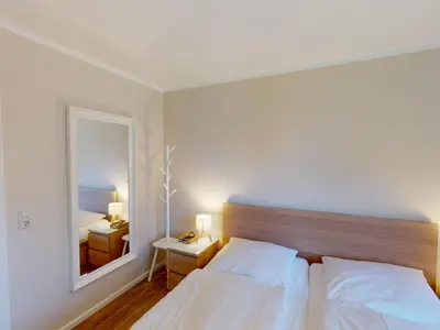 Ein Bett oder Betten in einem Zimmer der Unterkunft Anlage Am Wehrberg - 22D