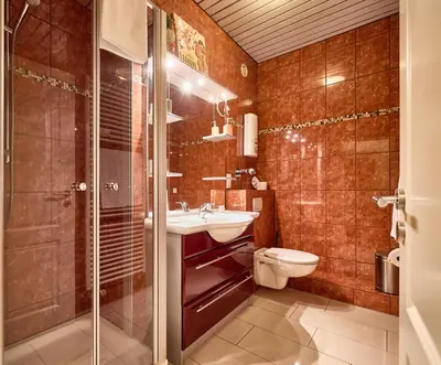Ein Badezimmer in der Unterkunft Haus Panorama - 127