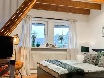 Ein Bett oder Betten in einem Zimmer der Unterkunft Ferienwohnung Erholung & Meer