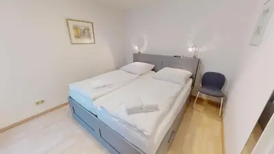 Ein Bett oder Betten in einem Zimmer der Unterkunft Stranddüne - 5