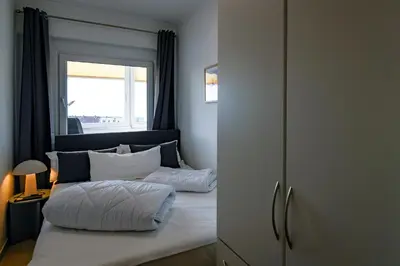 Ein Bett oder Betten in einem Zimmer der Unterkunft Strandhochhaus SHE6