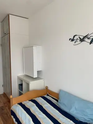 Ein Bett oder Betten in einem Zimmer der Unterkunft Haus Poseidon, Ferienwohnung POS30