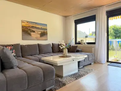 Ein Sitzbereich in der Unterkunft Haus Strandgold FeWo 1