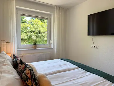 Ein Bett oder Betten in einem Zimmer der Unterkunft Haus Strandgold FeWo 1