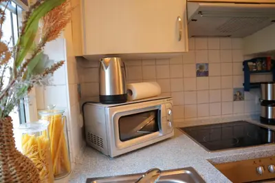 Küche/Küchenzeile in der Unterkunft Ferienhaus De lüttje Mööv