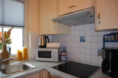 Küche/Küchenzeile in der Unterkunft Ferienhaus De lüttje Mööv