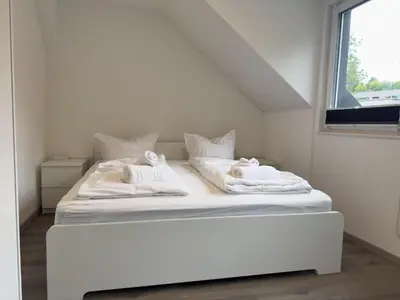 Ein Bett oder Betten in einem Zimmer der Unterkunft See Oase Bad Bederkesa
