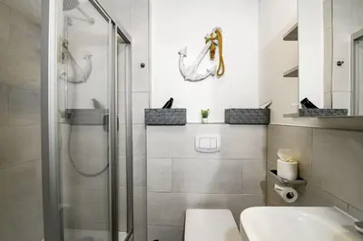 Ein Badezimmer in der Unterkunft Strandhochhaus SF01