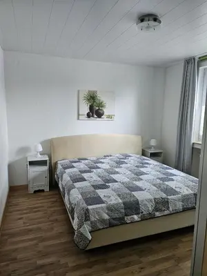 Ein Bett oder Betten in einem Zimmer der Unterkunft Ferienwohnung Majü 1