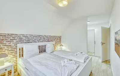 Ein Bett oder Betten in einem Zimmer der Unterkunft Modernes Ferienhaus Mit Sauna