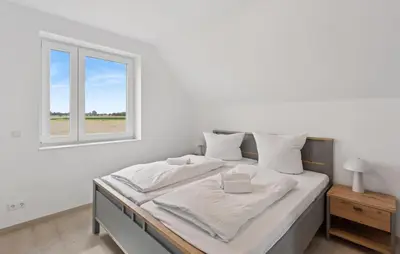 Ein Bett oder Betten in einem Zimmer der Unterkunft Modernes Ferienhaus Mit Sauna