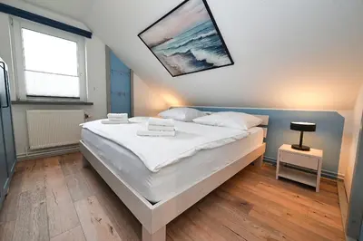 Ein Bett oder Betten in einem Zimmer der Unterkunft Latje Batje Büsum
