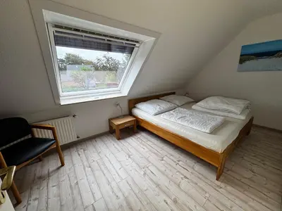 Ein Bett oder Betten in einem Zimmer der Unterkunft Ferienwohnung Knechtsand Cuxhaven