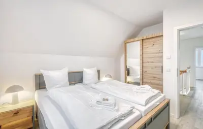 Ein Bett oder Betten in einem Zimmer der Unterkunft Modernes Ferienhaus Mit Sauna
