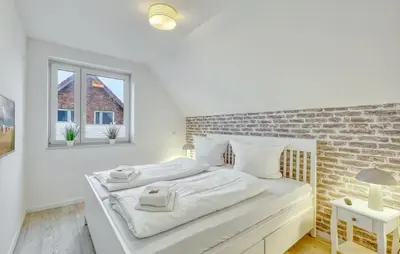 Ein Bett oder Betten in einem Zimmer der Unterkunft Modernes Ferienhaus Mit Sauna