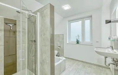 Ein Badezimmer in der Unterkunft Modernes Ferienhaus Mit Sauna