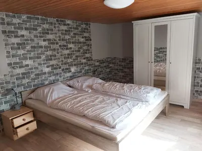 Ein Bett oder Betten in einem Zimmer der Unterkunft HuPes-Ferienhaus