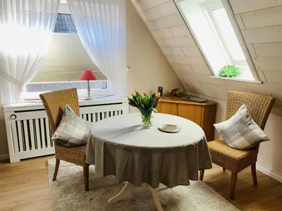 Ein Sitzbereich in der Unterkunft Haus Hollmann