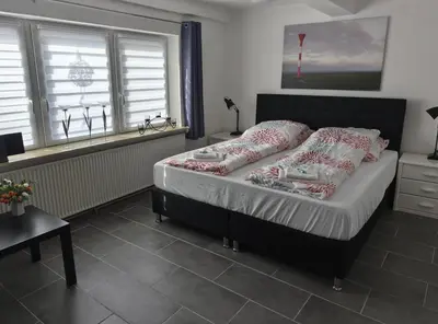 Ein Bett oder Betten in einem Zimmer der Unterkunft Relax-Belum bei Otterndorf LK Cuxhaven